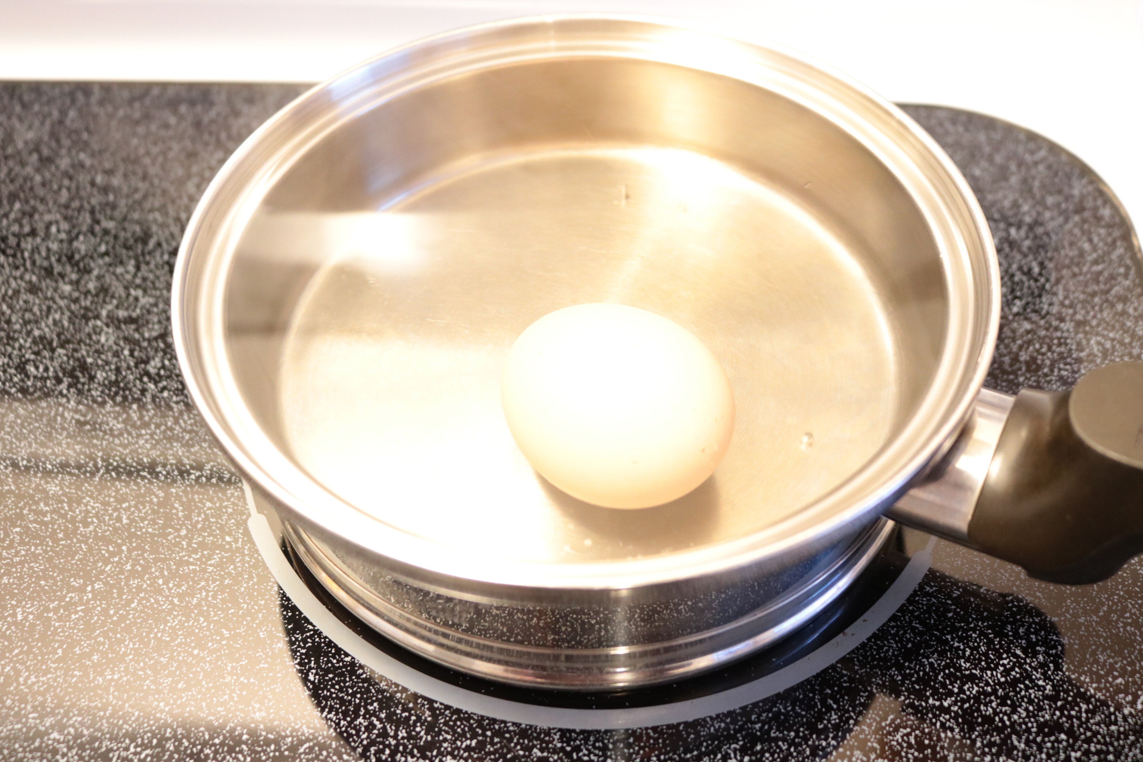 Boiling egg to make miracle salve.